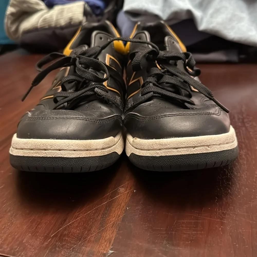 New Balance men’s black and gold/tan sneakers size 12